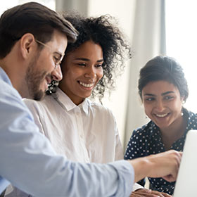 Happy Customers Looking at Computer